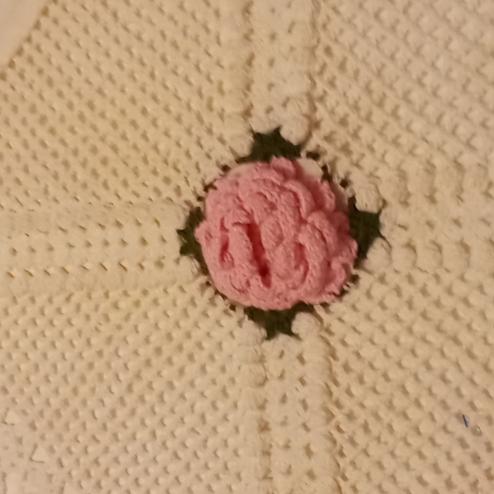 Pillow cases one set, vintage looking knitted o one side with a rose in the cent